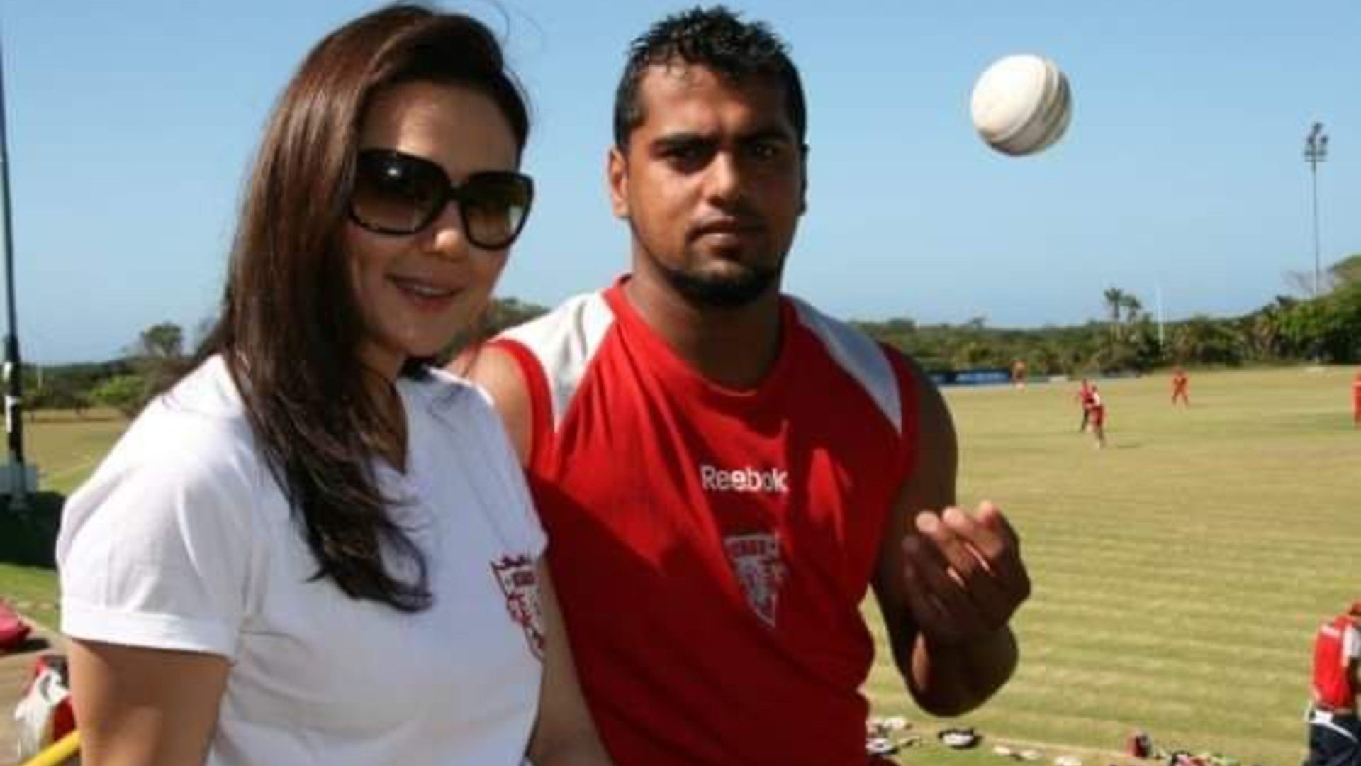Yusuf Abdulla can be seen posing with the ball alongside Preity Zinta, who is the owner of the Punjab-based IPL franchise.