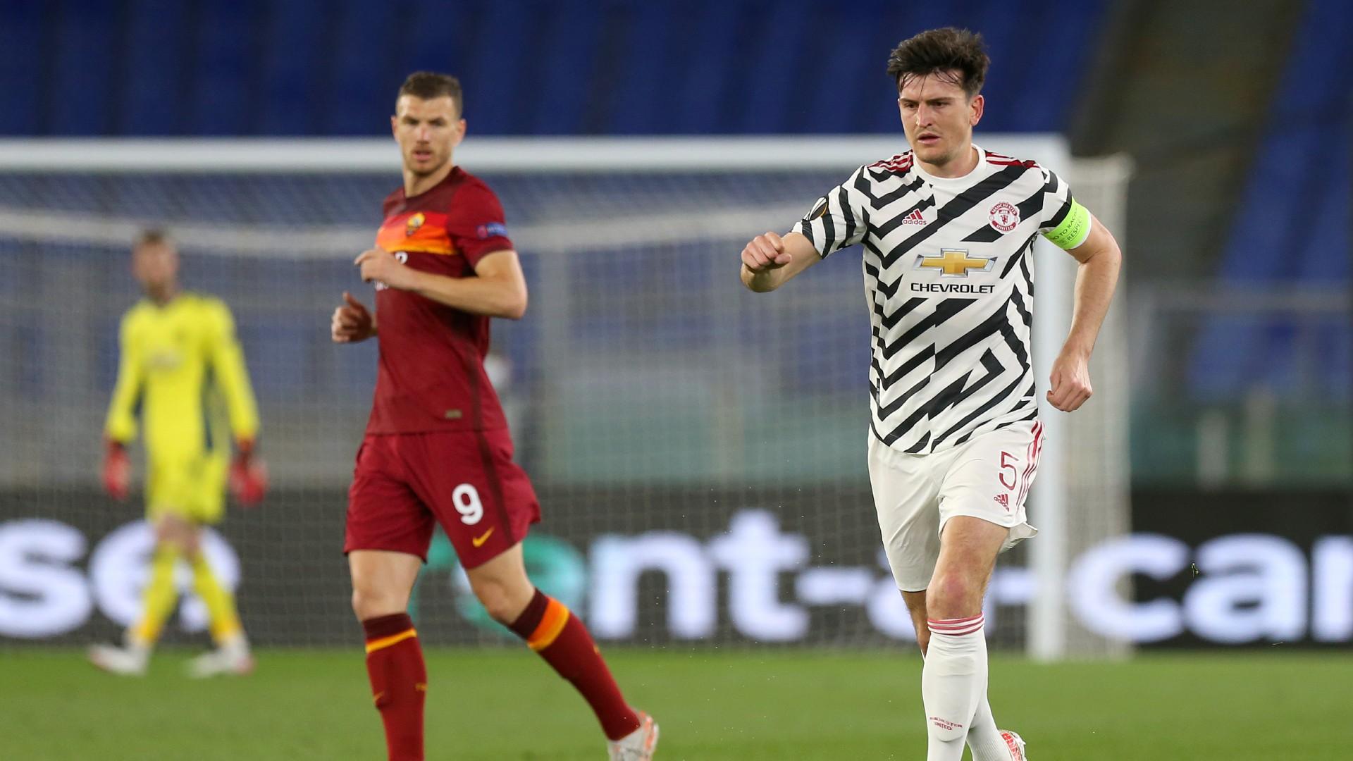 Harry Maguire (right) in action in Rome; Credit: Manchester United Twitter